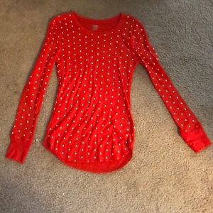 A red shirt with white polkadots